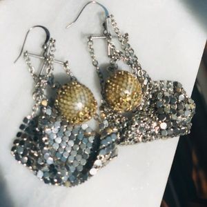 Disco balls in a blanket gold and silver earrings.